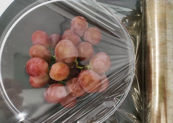 電子レンジの食品等級の収縮の覆いの包装はフィルム透明な9-12um厚くしがみつく